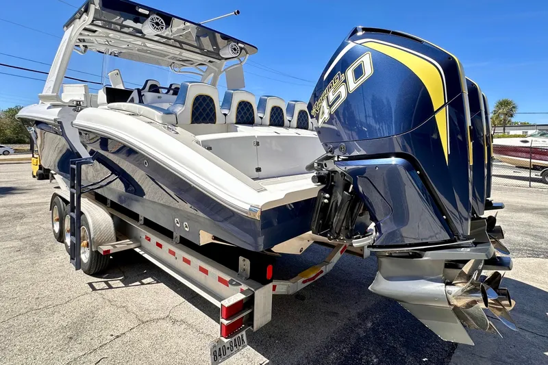  Yacht Photos Pics 2022 Midnight Express 37 Open boat with powerful outboard engines on a trailer.