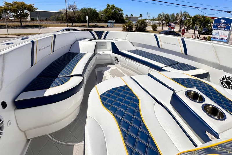  Yacht Photos Pics Luxurious interior of 2022 Midnight Express 37 Open boat with blue and white seating.