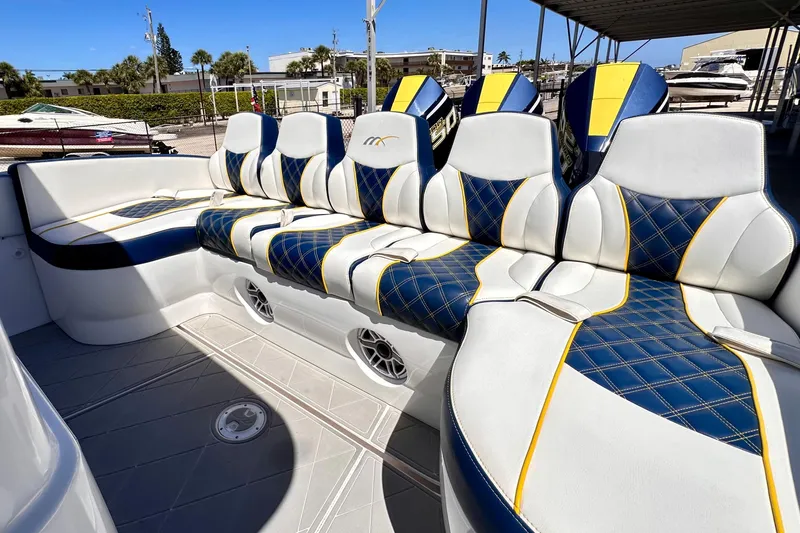 Yacht Photos Pics Luxurious seating on 2022 Midnight Express 37 Open boat with blue and yellow accents.