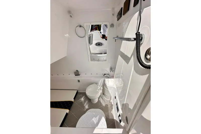  Yacht Photos Pics Interior of 2022 Midnight Express 37 Open boat bathroom with modern fixtures.