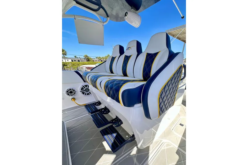  Yacht Photos Pics Luxury seating on 2022 Midnight Express 37 Open boat, featuring stylish blue and white upholstery.