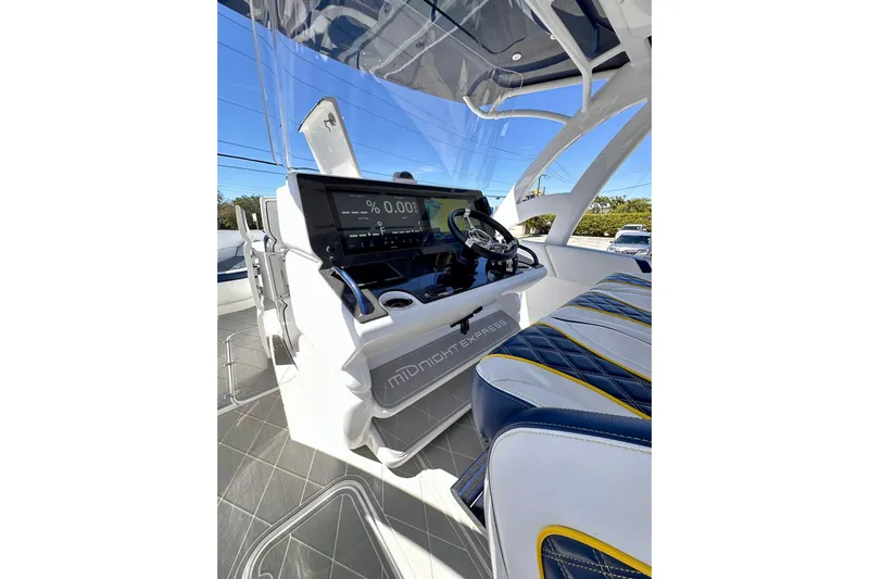  Yacht Photos Pics 2022 Midnight Express 37 Open boat cockpit with modern controls and stylish seating.