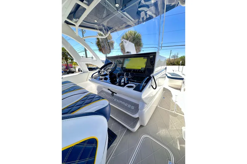  Yacht Photos Pics 2022 Midnight Express 37 Open boat cockpit with modern navigation system and stylish seating.