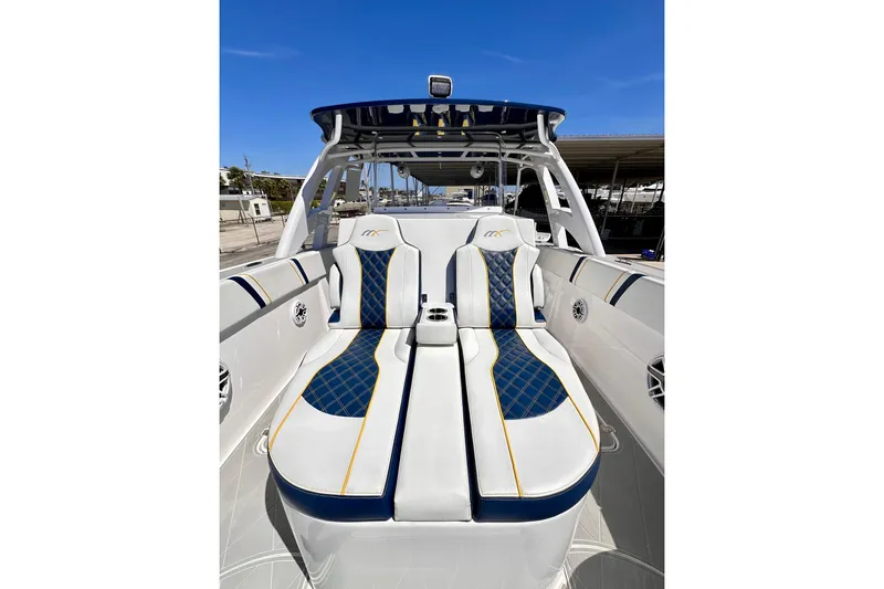  Yacht Photos Pics 2022 Midnight Express 37 Open boat with luxurious blue and white seating.