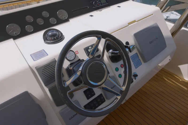  Yacht Photos Pics Steering wheel and controls of 2014 Fairline Squadron 78 Custom yacht.