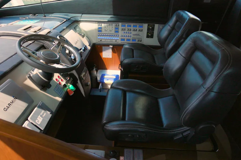  Yacht Photos Pics 2014 Fairline Squadron 78 Custom yacht cockpit with leather seats and advanced controls.