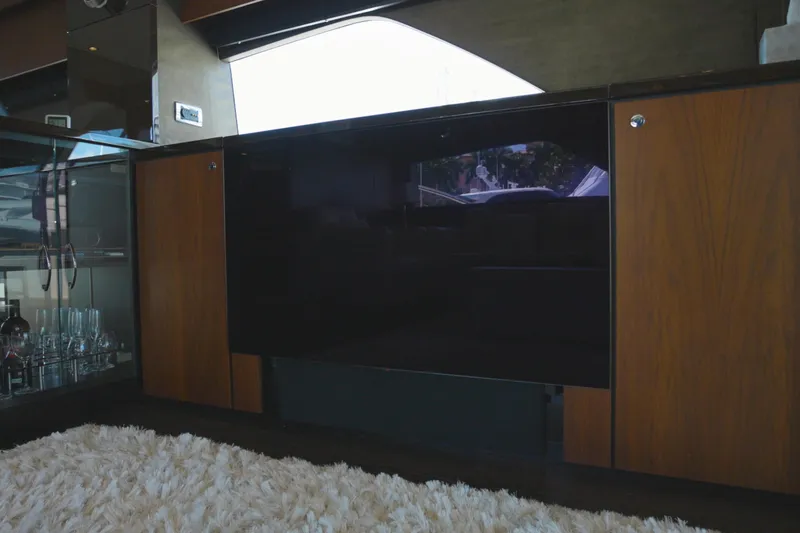  Yacht Photos Pics Luxurious interior of 2014 Fairline Squadron 78 Custom yacht with elegant wood cabinetry.