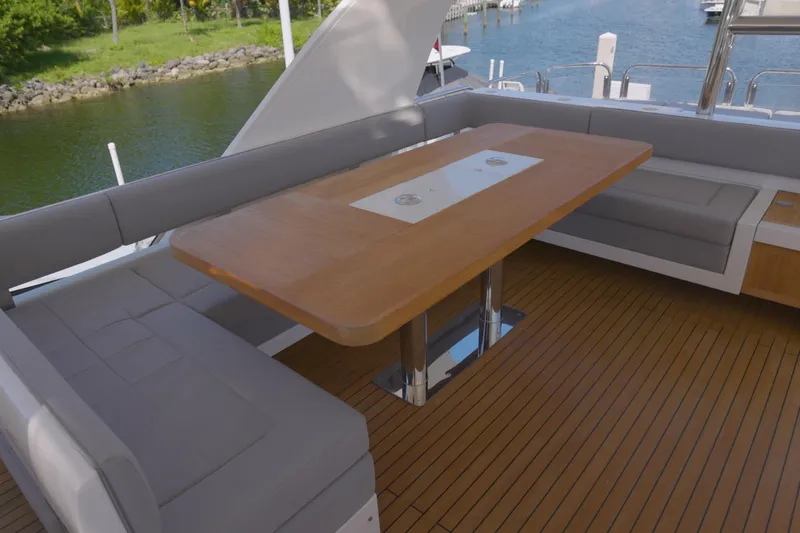  Yacht Photos Pics Luxurious 2014 Fairline Squadron 78 Custom yacht deck with elegant seating and wooden table.