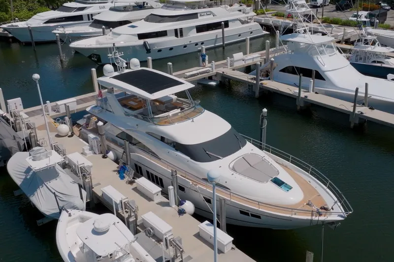  Yacht Photos Pics 2014 Fairline Squadron 78 Custom yacht docked at marina, surrounded by other luxury boats.