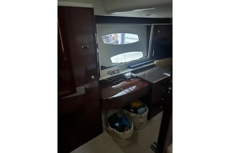  Yacht Photos Pics Interior of 2014 Meridian 441 Sedan yacht with window and storage baskets.