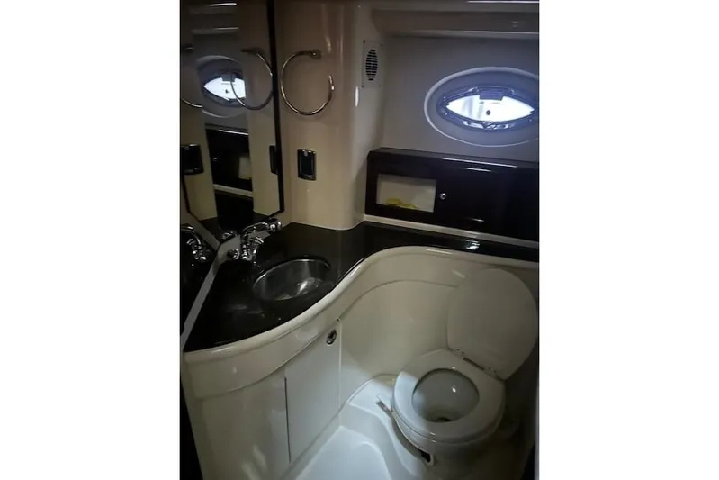  Yacht Photos Pics Luxurious bathroom in 2014 Meridian 441 Sedan yacht with sink and toilet.
