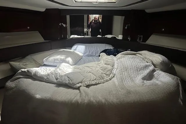  Yacht Photos Pics Luxurious bedroom interior of 2014 Meridian 441 Sedan yacht with cozy bedding.