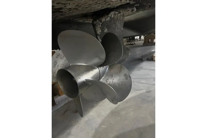  Yacht Photos Pics 2014 Meridian 441 Sedan boat propeller in a workshop setting.