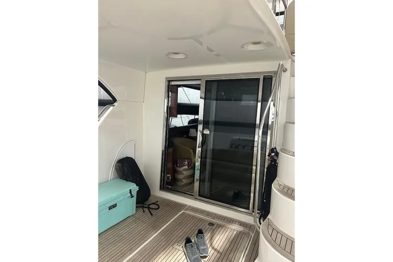  Yacht Photos Pics 2014 Meridian 441 Sedan yacht interior with sliding glass door and deck accessories.
