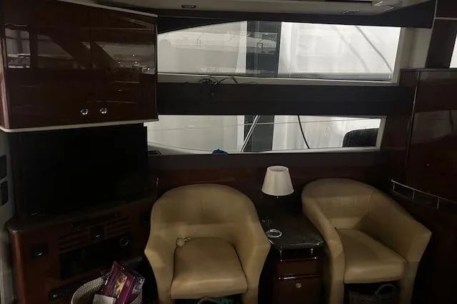  Yacht Photos Pics Interior of 2014 Meridian 441 Sedan yacht with chairs and a TV.