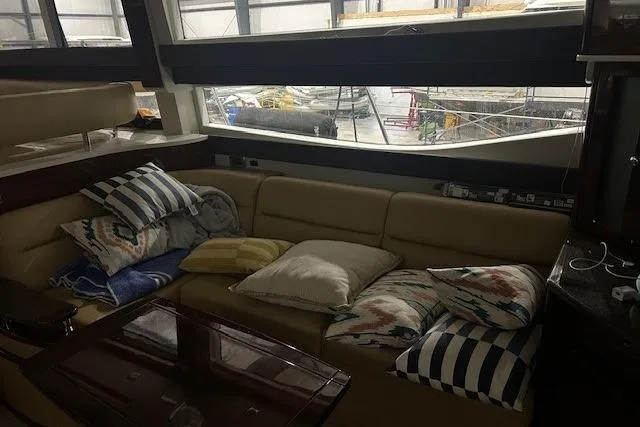  Yacht Photos Pics Interior of 2014 Meridian 441 Sedan yacht with cozy seating and decorative pillows.