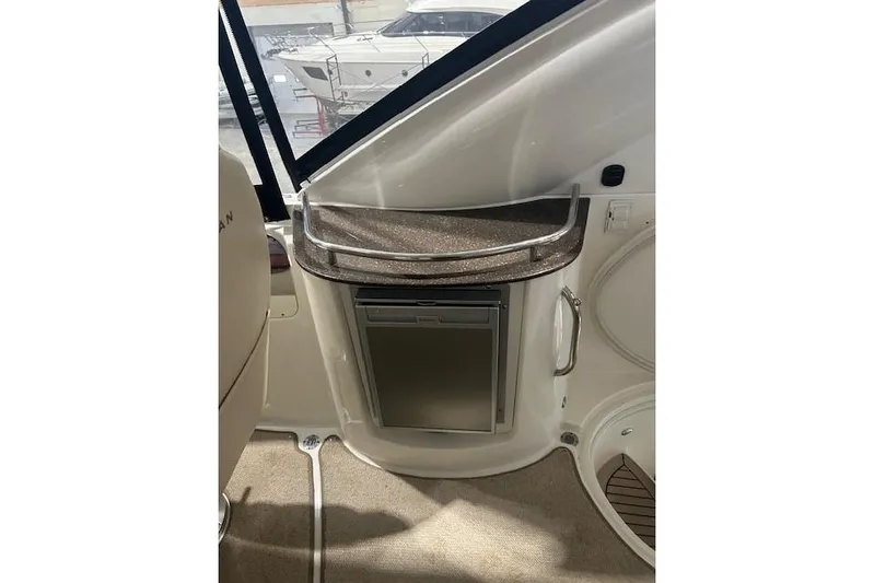  Yacht Photos Pics Interior of 2014 Meridian 441 Sedan yacht with compact fridge and countertop.