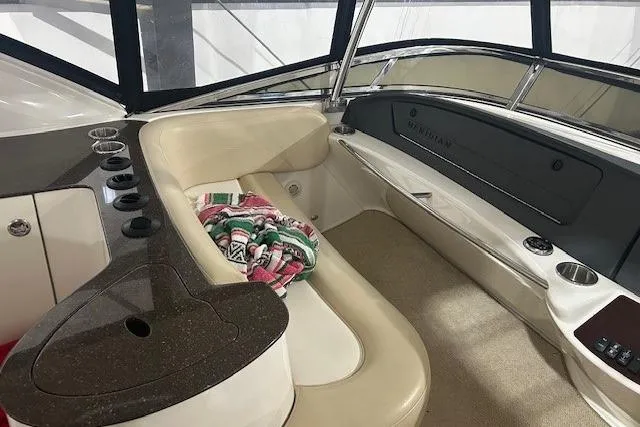  Yacht Photos Pics Interior of a 2014 Meridian 441 Sedan yacht with seating and colorful blanket.