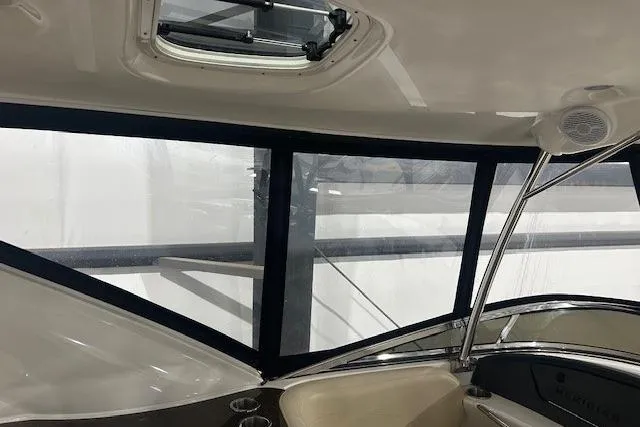  Yacht Photos Pics Interior view of a 2014 Meridian 441 Sedan yacht with large windows and seating.