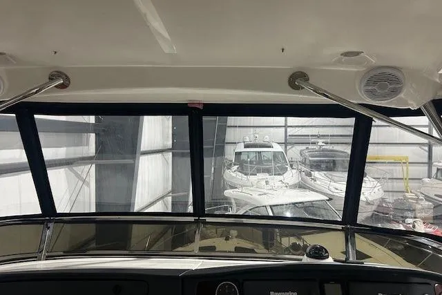  Yacht Photos Pics Interior view of 2014 Meridian 441 Sedan yacht cockpit with marina background.