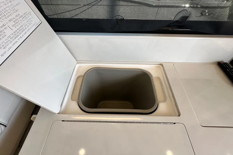  Yacht Photos Pics Open storage compartment on 2021 Regal 36 XO boat interior.