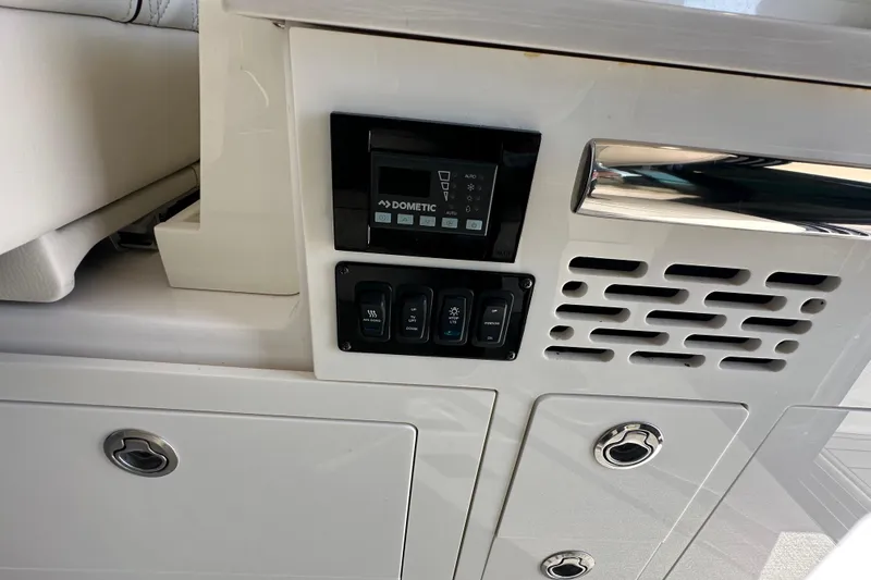  Yacht Photos Pics Control panel on 2021 Regal 36 XO boat, featuring Dometic system and switches.