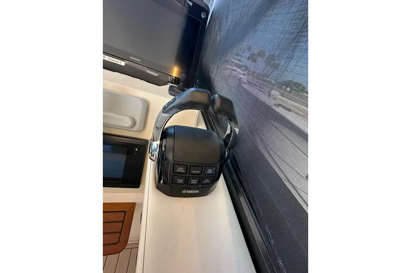  Yacht Photos Pics Yamaha throttle control on 2021 Regal 36 XO boat dashboard, featuring navigation equipment.