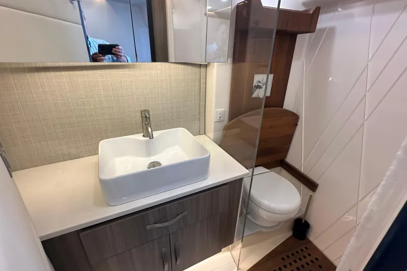 Yacht Photos Pics Modern bathroom in 2021 Regal 36 XO yacht with sleek sink and toilet.