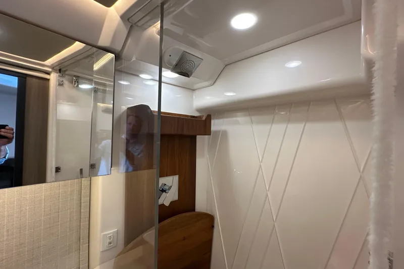  Yacht Photos Pics Interior of 2021 Regal 36 XO yacht bathroom with modern fixtures and lighting.