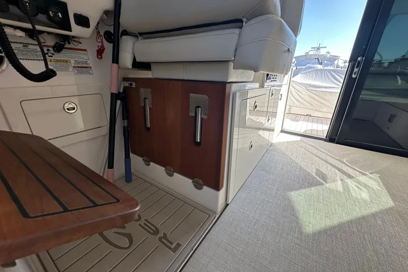  Yacht Photos Pics 2021 Regal 36 XO yacht interior with seating and storage, showcasing luxury design.