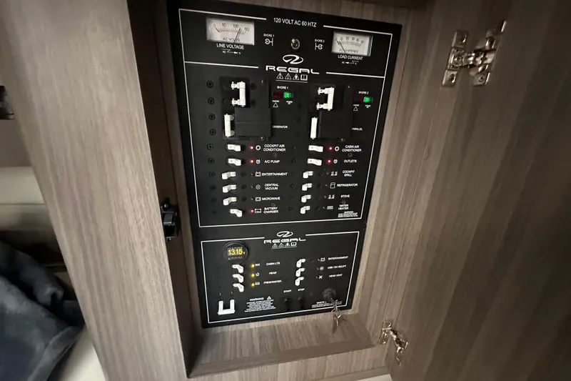  Yacht Photos Pics Electrical panel of 2021 Regal 36 XO boat, featuring various switches and controls.