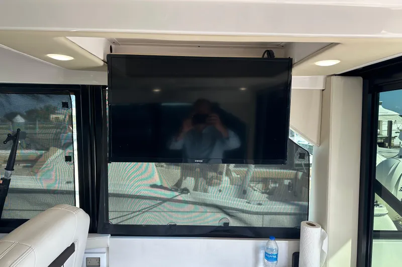  Yacht Photos Pics Interior of 2021 Regal 36 XO yacht with mounted TV and window view.