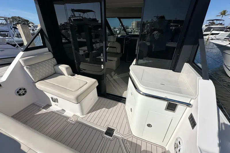  Yacht Photos Pics 2021 Regal 36 XO yacht deck with seating and sleek design.