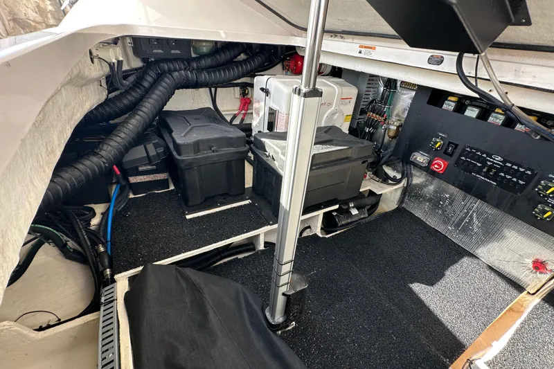  Yacht Photos Pics 2021 Regal 36 XO engine compartment with batteries and control panel.