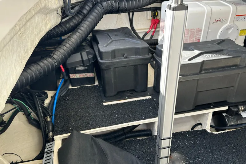  Yacht Photos Pics Engine compartment of a 2021 Regal 36 XO boat, featuring battery boxes and wiring.