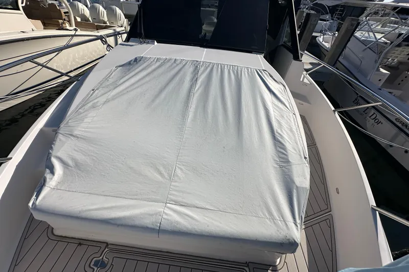  Yacht Photos Pics 2021 Regal 36 XO boat with covered deck, docked at marina.