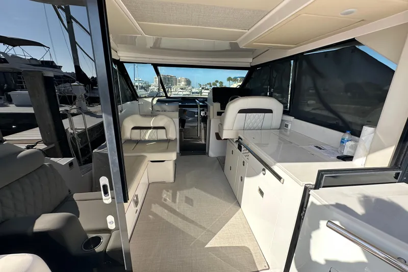  Yacht Photos Pics Interior of 2021 Regal 36 XO yacht, featuring modern seating and sleek design.