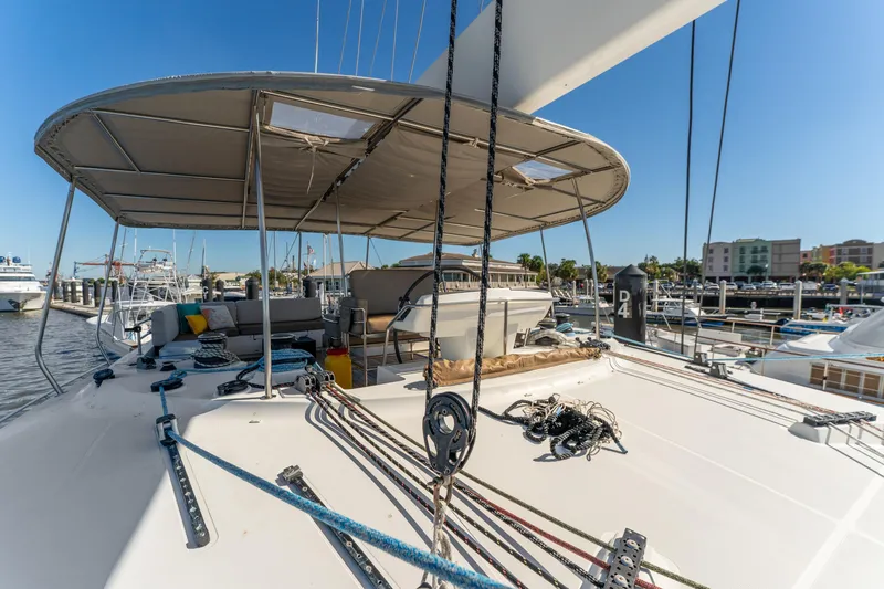 Worth The Wait Yacht Photos Pics Lagoon 560 yacht, 2012 model, docked at marina with spacious deck and seating area.