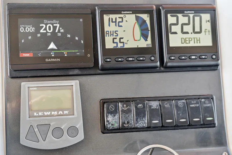 Worth The Wait Yacht Photos Pics Control panel of a 2012 Lagoon 560 yacht with Garmin displays and Lewmar controls.