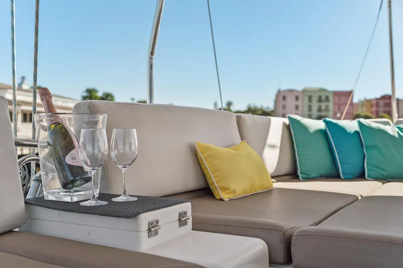 Worth The Wait Yacht Photos Pics Luxurious Lagoon 560 yacht deck with champagne, glasses, and colorful cushions, 2012 model.