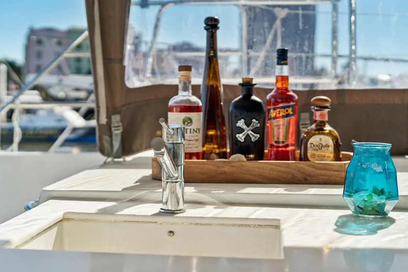 Worth The Wait Yacht Photos Pics Luxury yacht Lagoon 560 (2012) with bar setup and sink on deck.