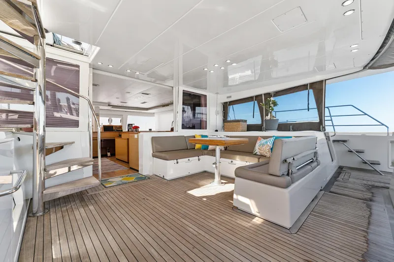 Worth The Wait Yacht Photos Pics Spacious interior of 2012 Lagoon 560 yacht with modern seating and dining area.