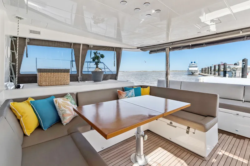 Worth The Wait Yacht Photos Pics Luxurious Lagoon 560 yacht interior with colorful cushions and ocean view, 2012 model.