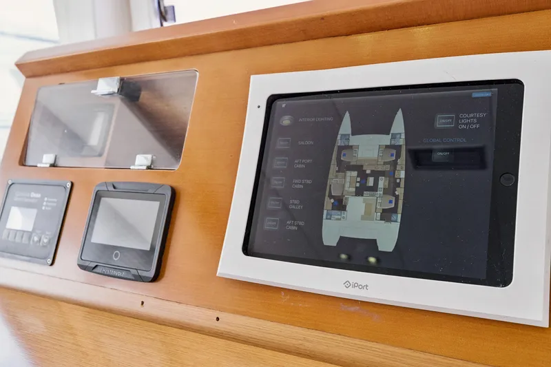 Worth The Wait Yacht Photos Pics Control panel of a 2012 Lagoon 560 yacht with touchscreen interface.