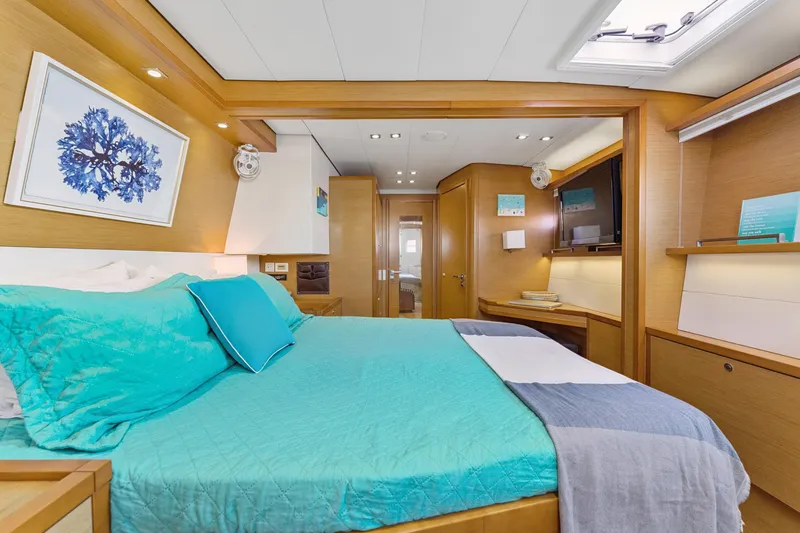 Worth The Wait Yacht Photos Pics Luxurious interior of 2012 Lagoon 560 yacht with elegant bedroom and modern amenities.