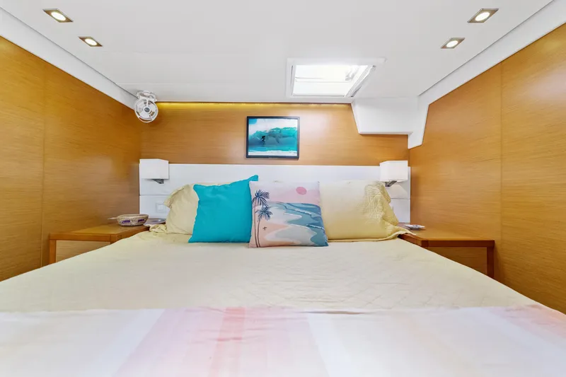 Worth The Wait Yacht Photos Pics Luxurious bedroom interior of 2012 Lagoon 560 yacht with modern decor and skylight.