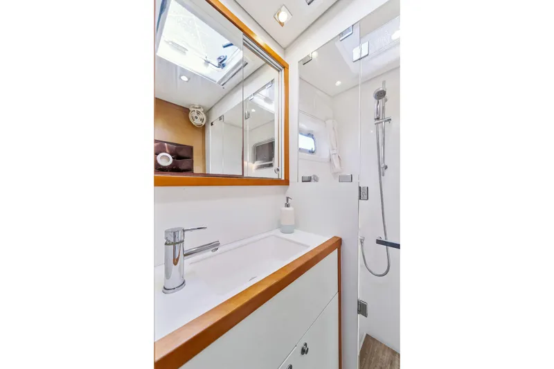 Worth The Wait Yacht Photos Pics Luxurious bathroom in 2012 Lagoon 560 yacht with modern fixtures and skylight.