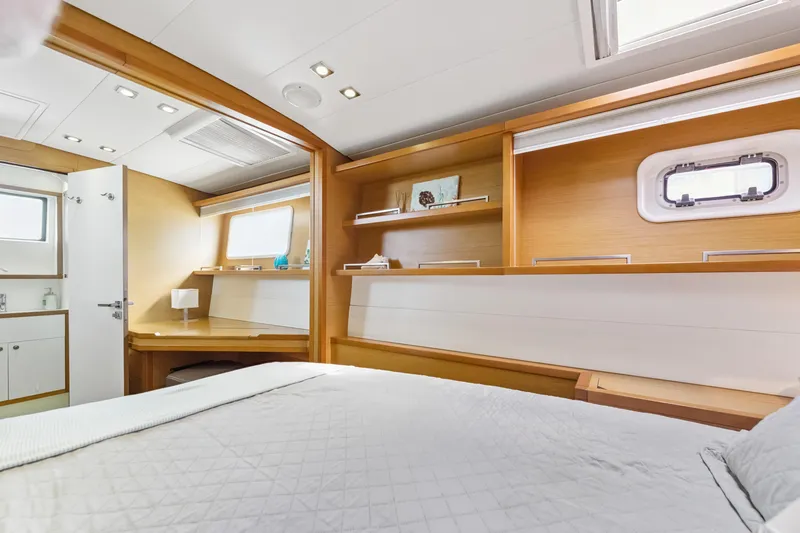 Worth The Wait Yacht Photos Pics Luxurious interior of 2012 Lagoon 560 yacht cabin with modern furnishings and natural light.