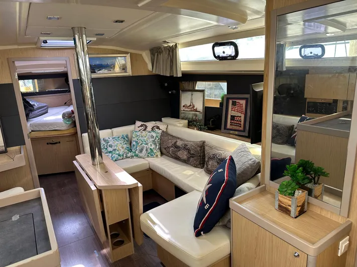  Yacht Photos Pics Interior of 2017 Beneteau Oceanis 41.1 yacht with cozy seating and modern decor.