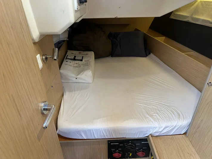  Yacht Photos Pics Cozy cabin interior of 2017 Beneteau Oceanis 41.1 sailboat with bed and storage.
